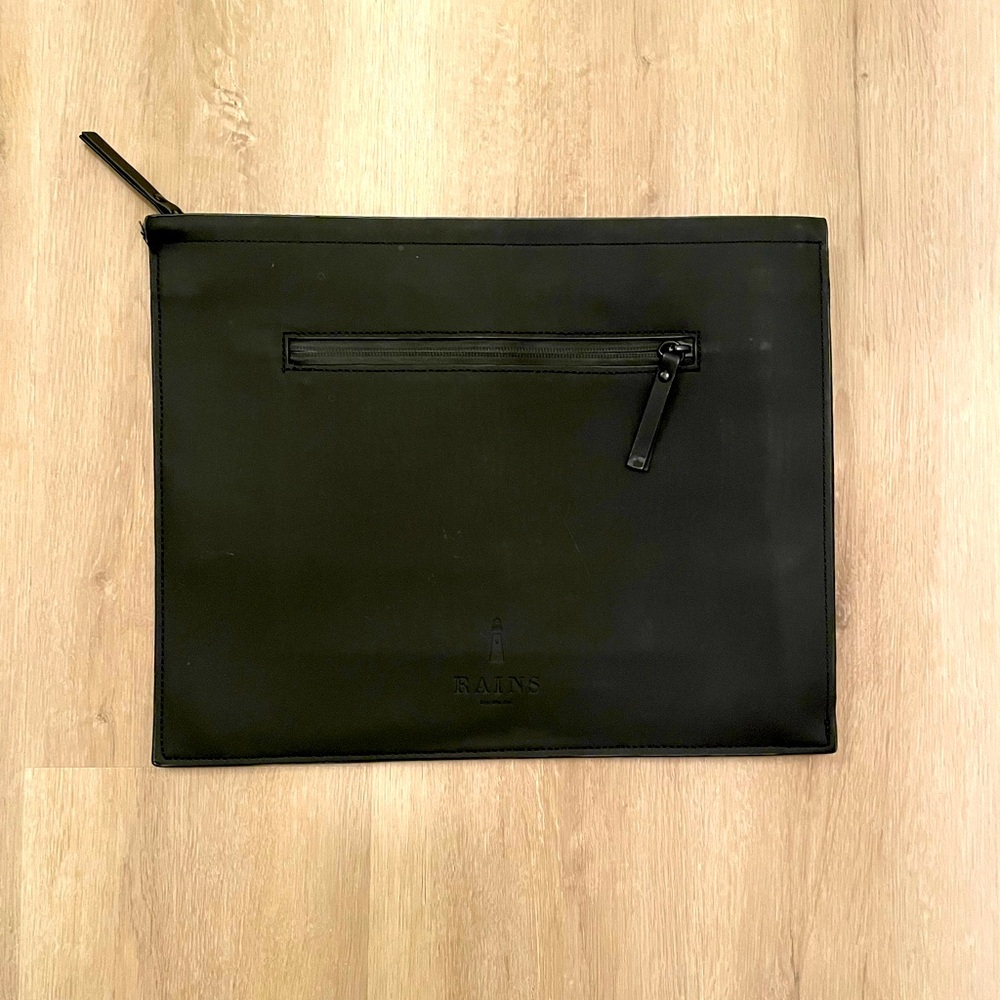 RAINS laptop sleeve with zipper closure